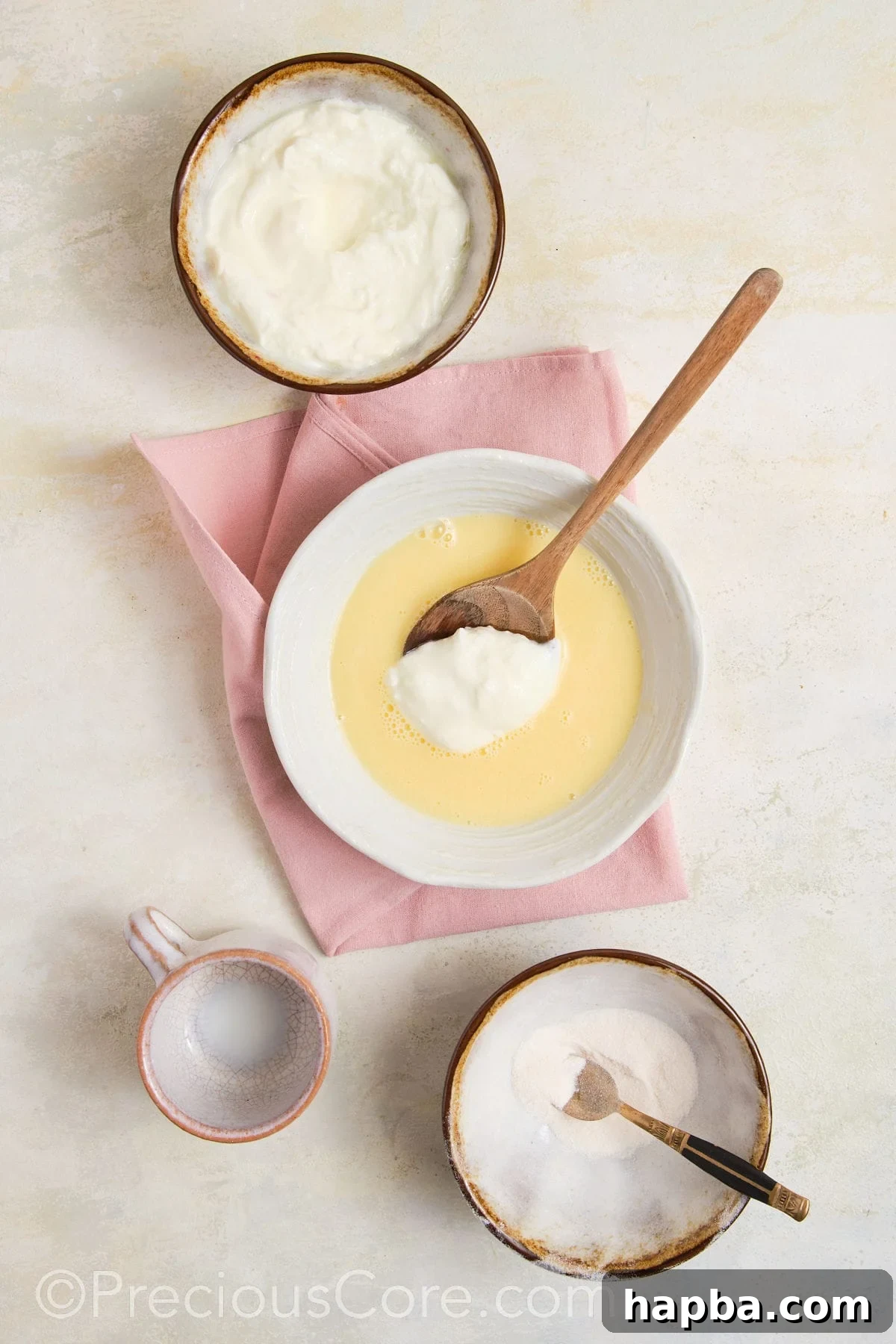 Greek yogurt being added to pudding mix.