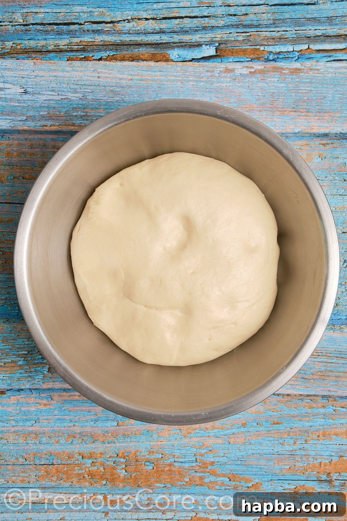 Homemade cinnamon roll dough after it has perfectly risen and doubled in size.