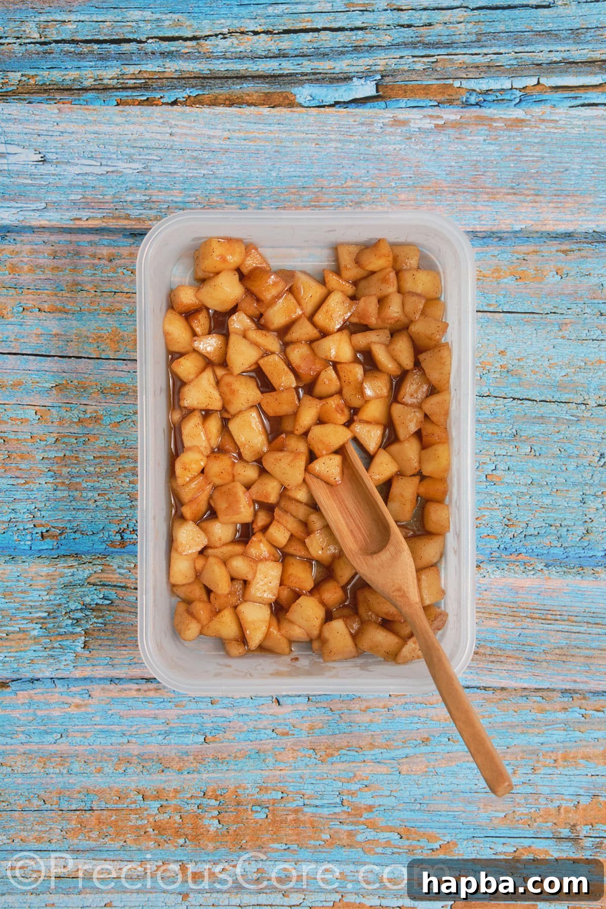 Perfectly cooked and cooled apple pie filling, ready to be spread onto the cinnamon roll dough.