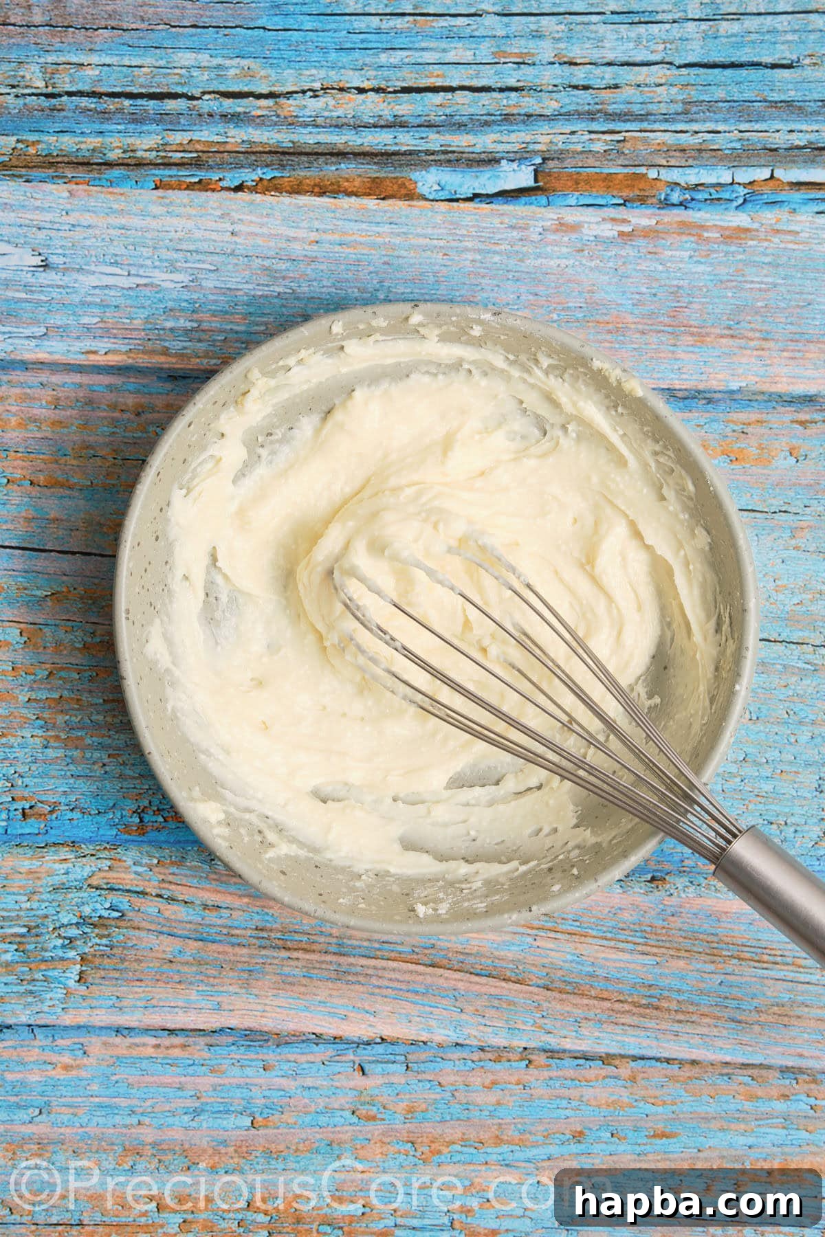 Creamy, smooth, and fluffy cream cheese frosting after being perfectly mixed, ready to spread.
