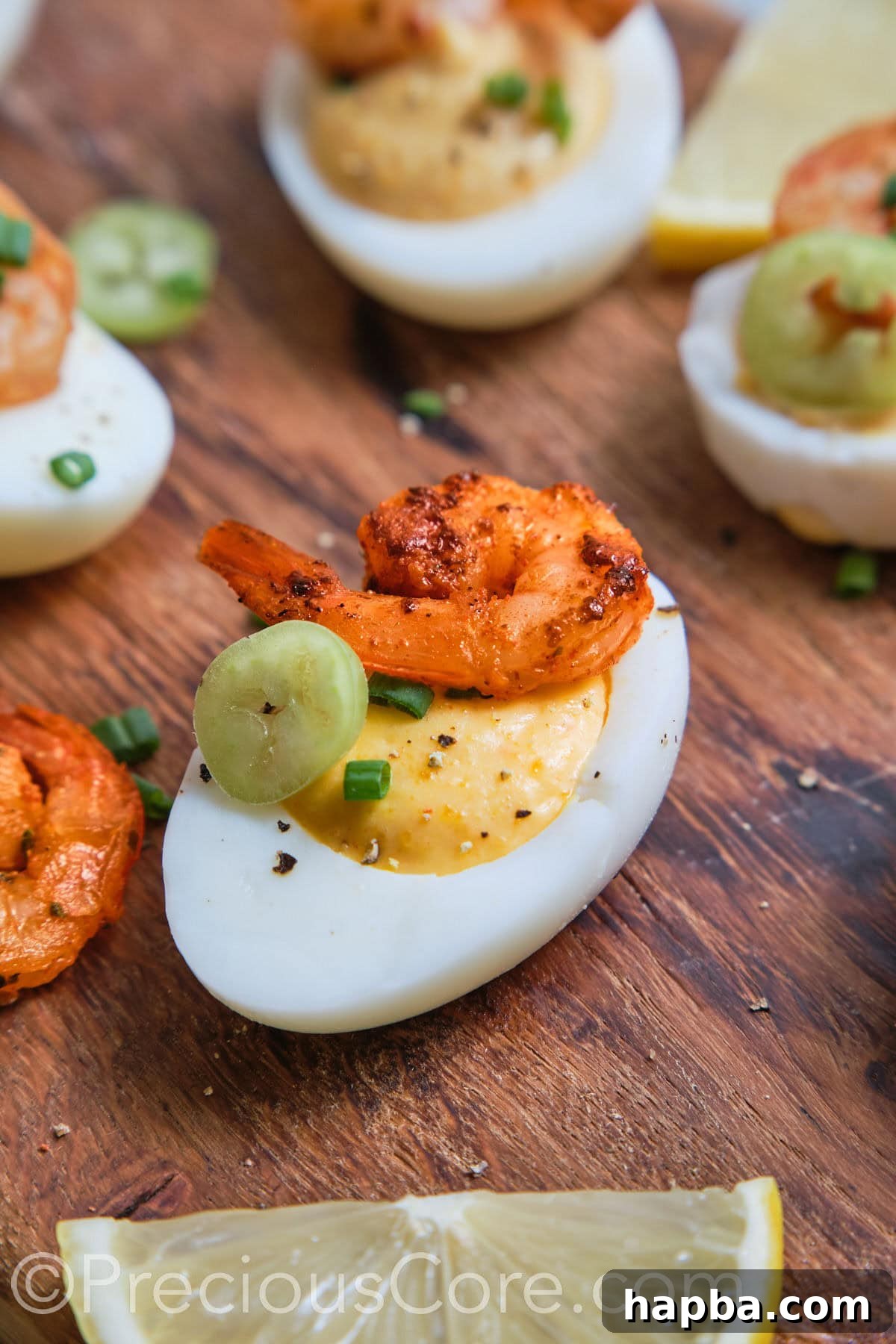 Kickin' Cajun Shrimp Deviled Eggs 4 Deviled Egg close up with shrimp and jalapeno.