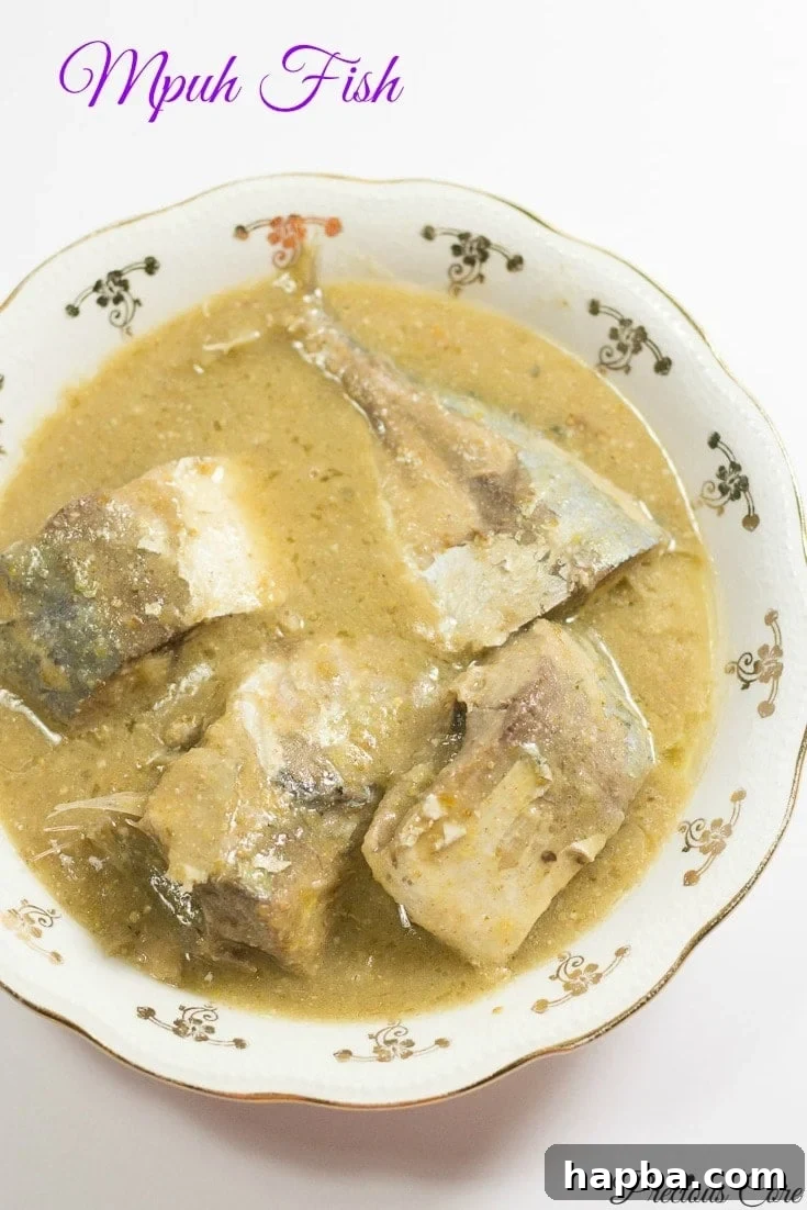 Mpuh fish in a bowl, showcasing the creamy white sauce and tender fish.