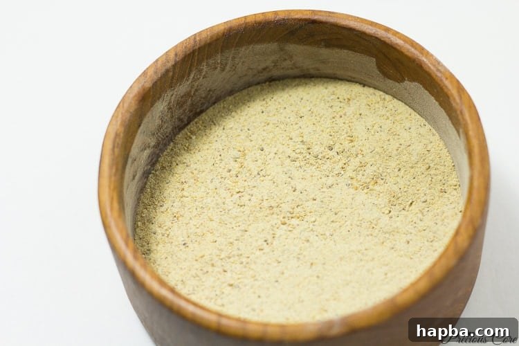 A bowl of homemade plantain flour, a versatile ingredient for Cameroonian dishes.