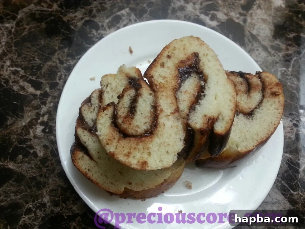 Foolproof Chocolate Bread Perfection 7 A single, inviting slice of Nutella braided bread, ready to be enjoyed on its own.