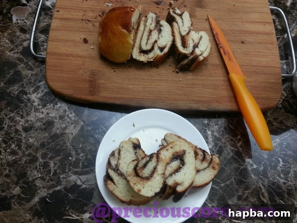 Foolproof Chocolate Bread Perfection 8 Another overhead shot of the full Nutella braided bread loaf on a cutting board, highlighting its intricate pattern.