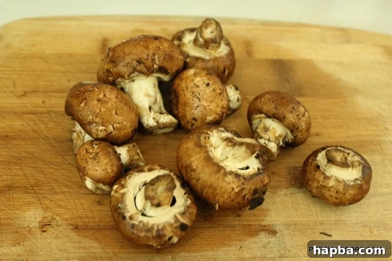 Fresh white button mushrooms, ready to be sliced for the stir fry