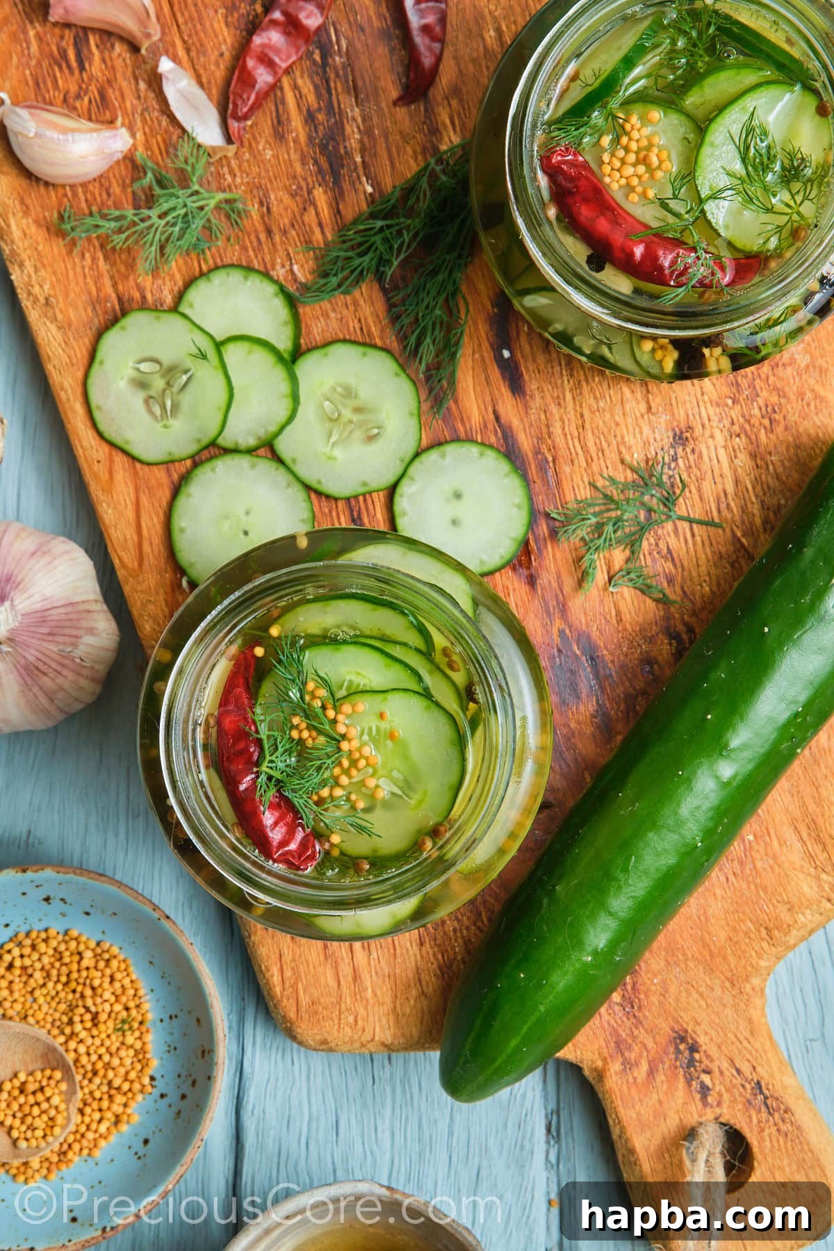 Speedy Zesty Pickles 5 Two jars filled with pickled cucumbers.