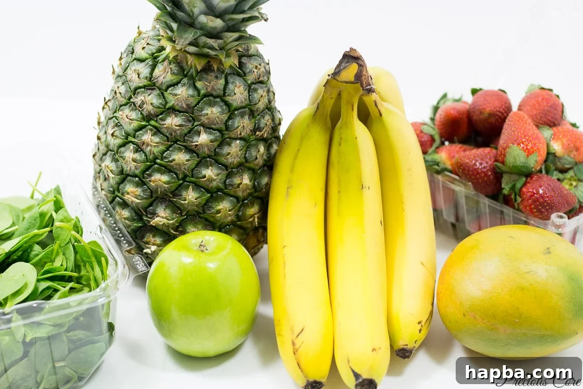 A vibrant display of fresh fruits on a kitchen counter, including bright yellow pineapple, ripe bananas, and juicy red strawberries, ready for blending into healthy smoothies.