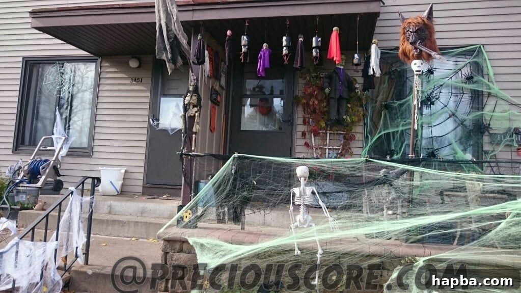 Spooky Photo Roundup 6 Halloween decoration featuring numerous artificial cobwebs covering bushes.