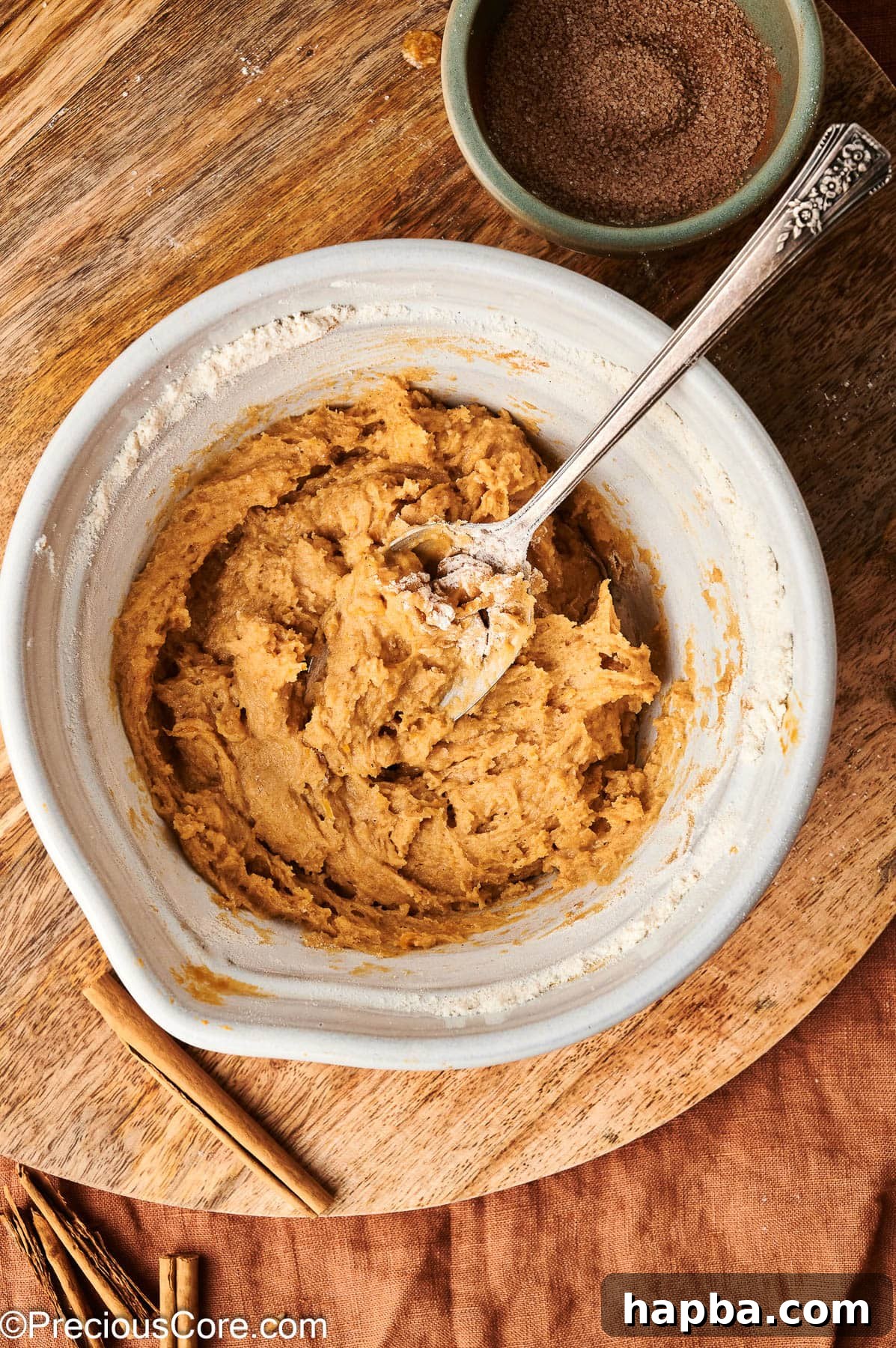 The finished pumpkin spice donut batter, smooth and ready for piping, resting in a bowl.
