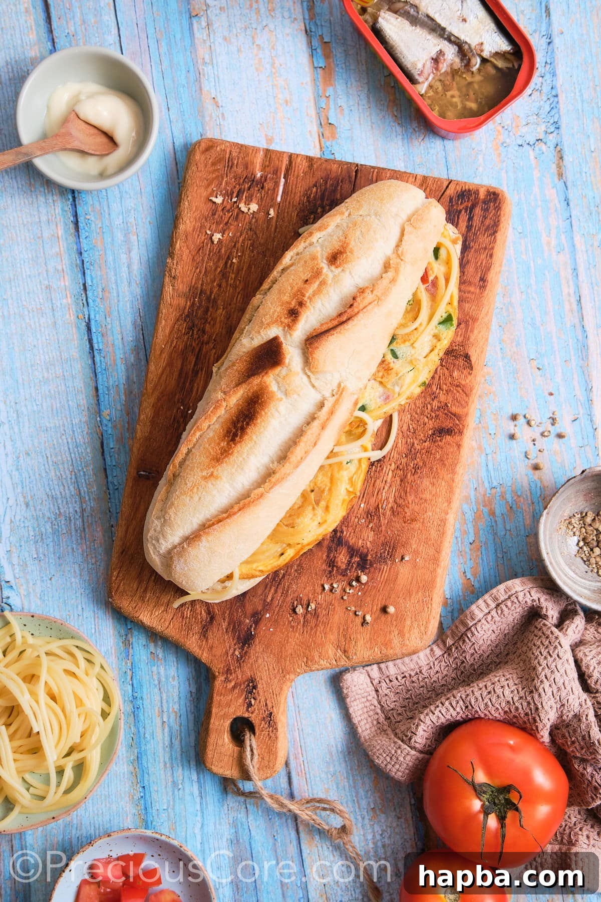 A freshly assembled spaghetti omelette sandwich, perfectly closed and ready to be enjoyed.