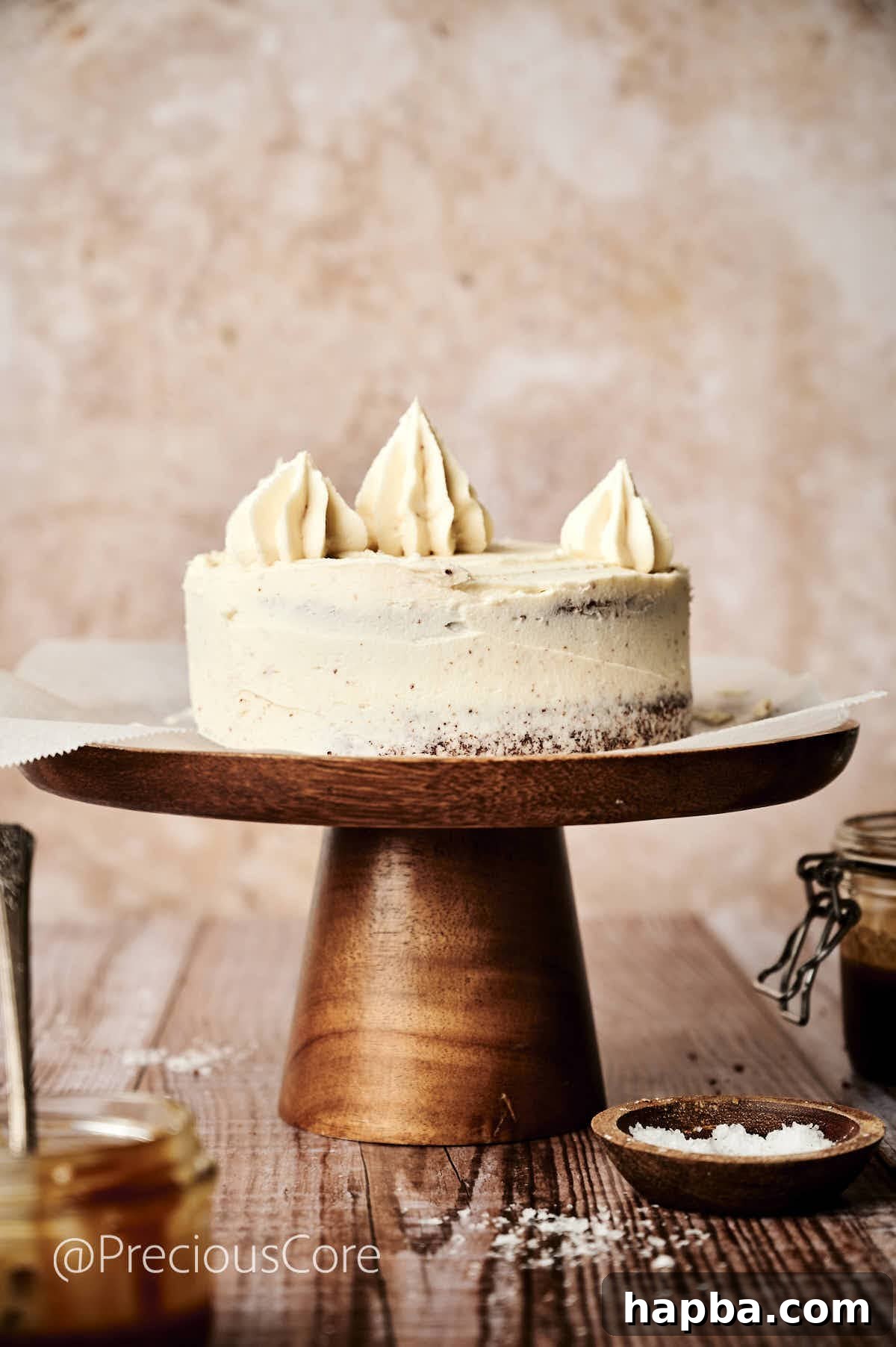 Salted Caramel Dream Cake 14 A fully assembled salted caramel cake with decorative caramel frosting piped on top, ready for final touches.