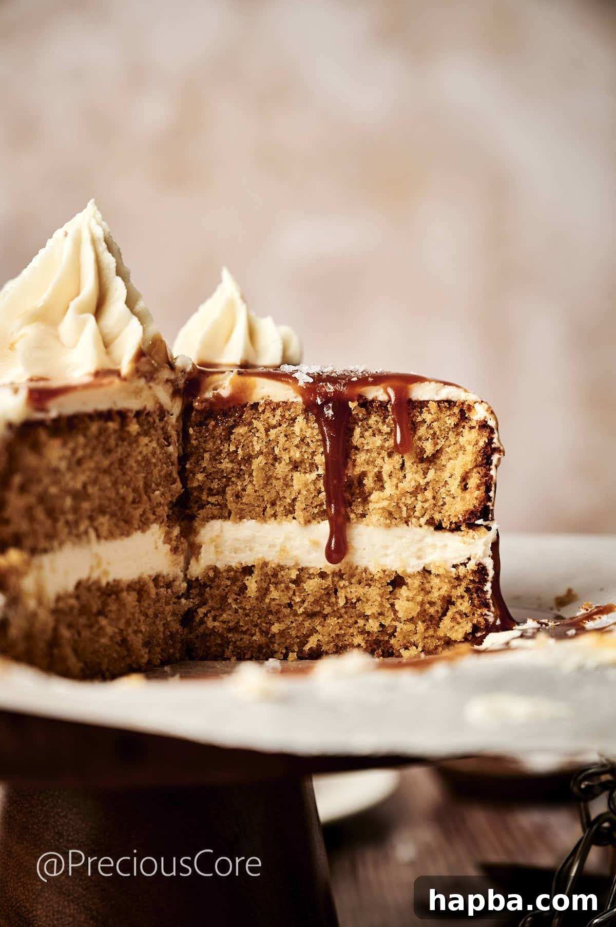 Salted Caramel Dream Cake 16 A slice of salted caramel cake cut open, revealing its moist layers and creamy frosting.