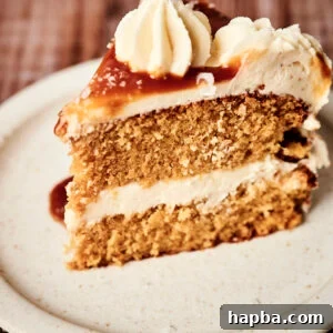 A slice of salted caramel cake, showcasing its moist layers and rich frosting.