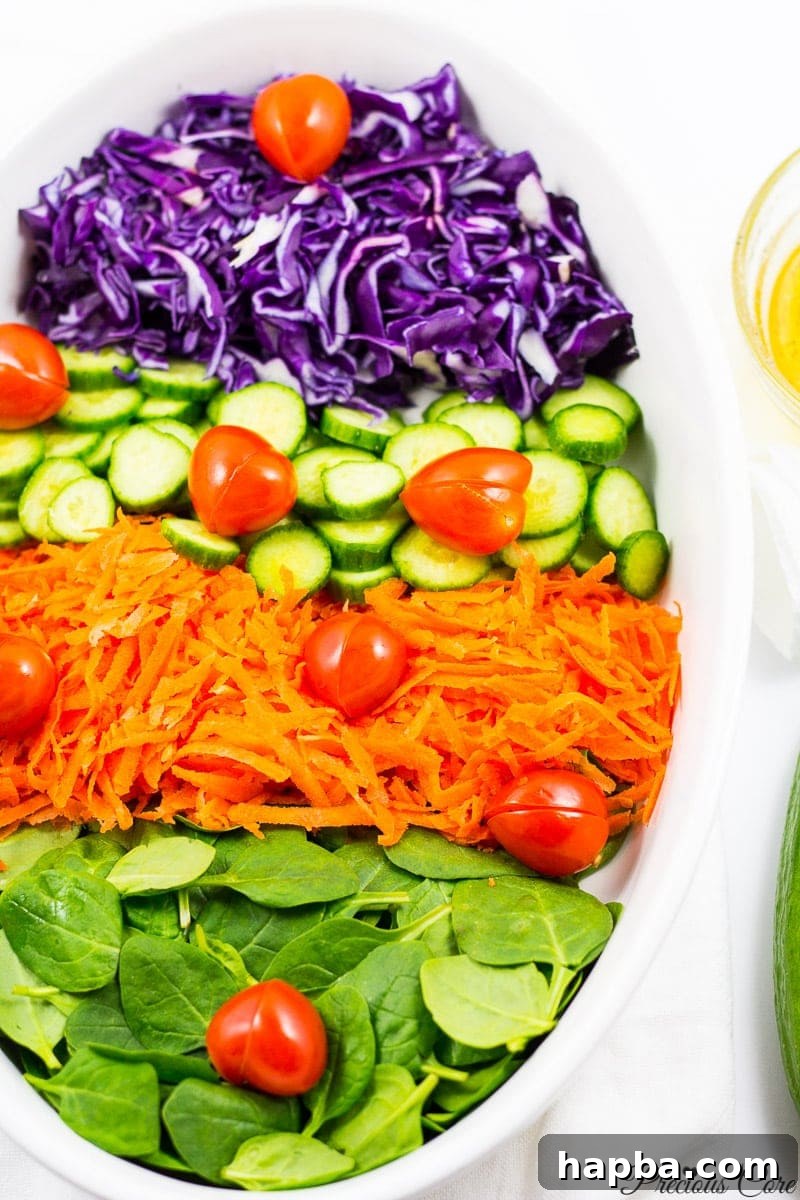 Spinach red cabbage salad with tomato hearts and honey lemon dressing