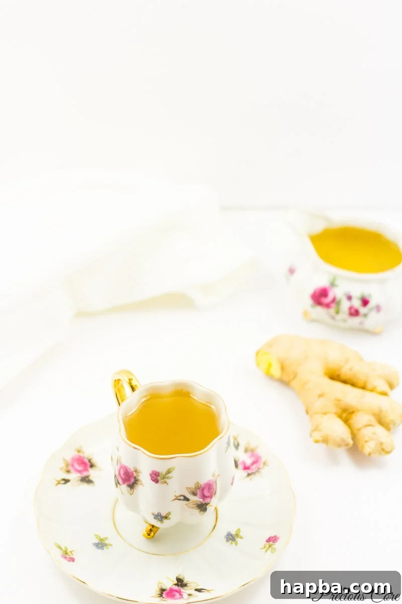 A finished mug of ginger tea, garnished with fresh ginger slices, ready to be enjoyed, showcasing the final product of the recipe.