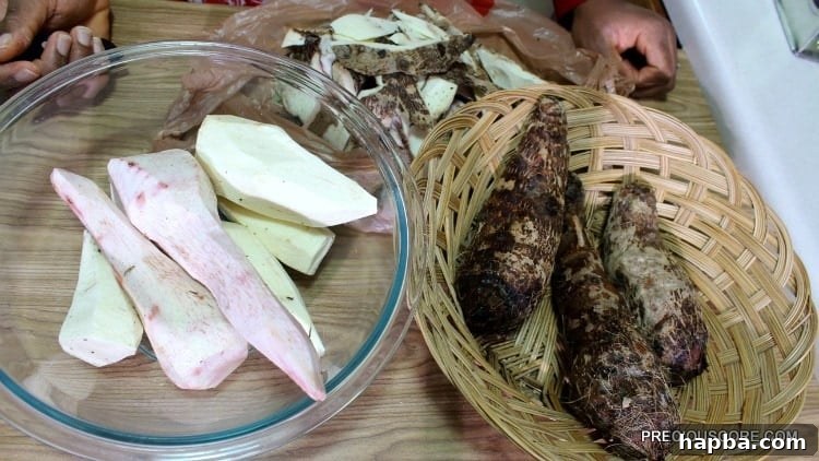 Bowls containing both peeled and unpeeled cocoyams, illustrating the preparation stage.