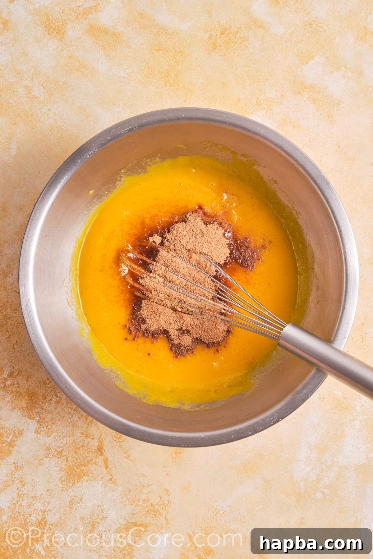 Brown sugar and other ingredients added to egg mixture.