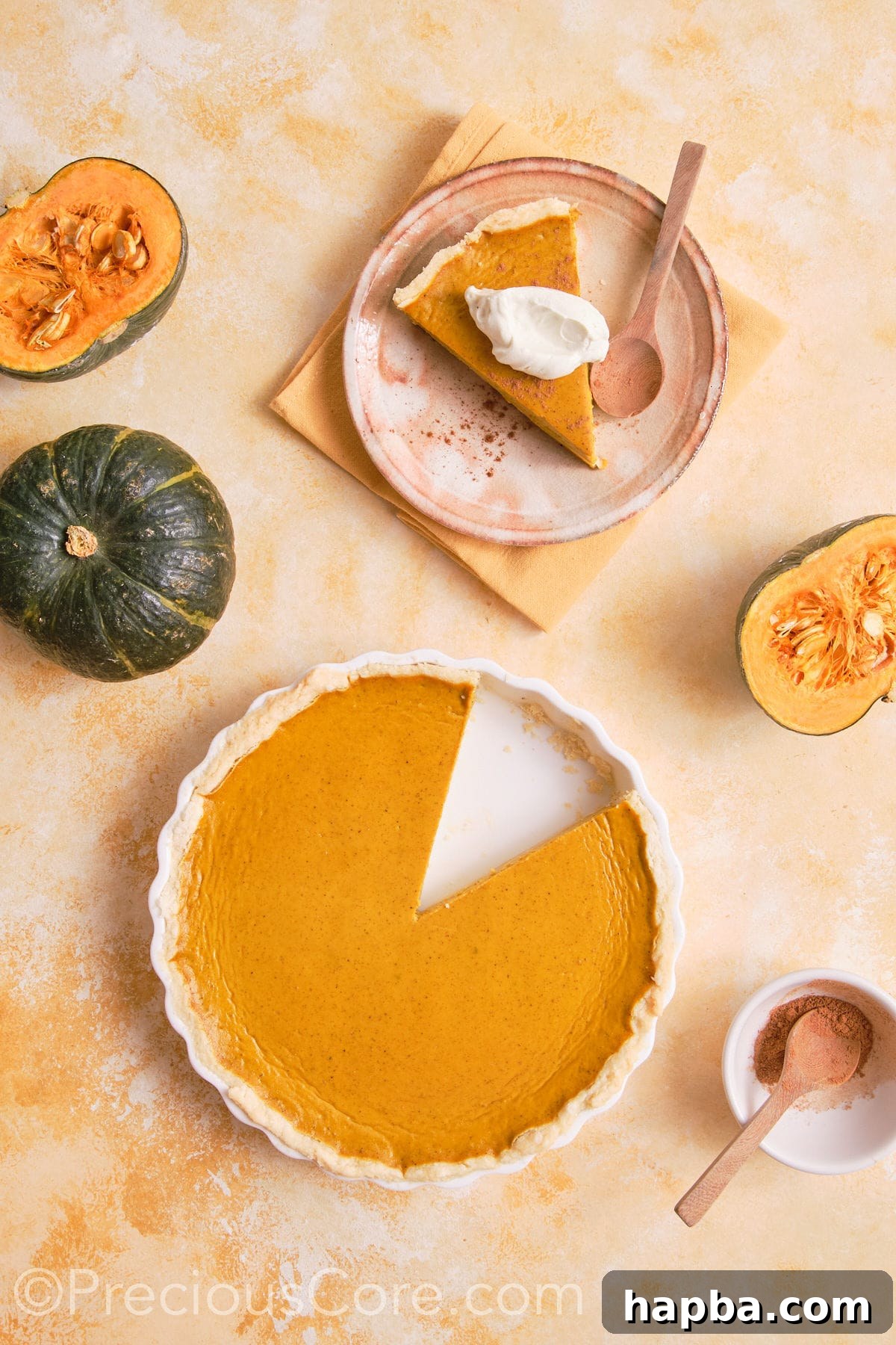 Pumpkin pie with a slice taken out.