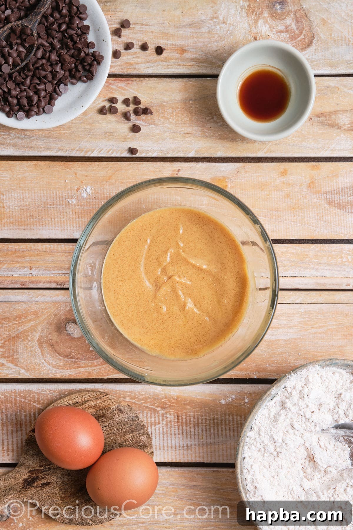 Creamed butter, granulated sugar, and brown sugar mixture in a bowl.