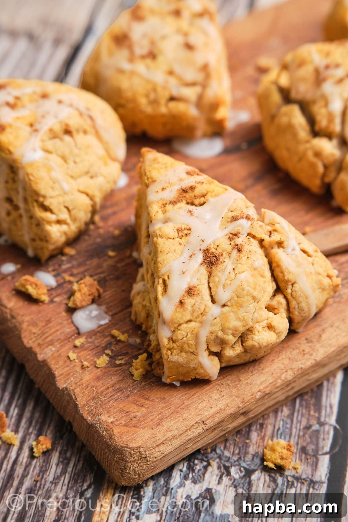 Golden Sweet Potato Scones 4 A close-up shot of a single sweet potato scone, showcasing its tender texture and golden crust, with a hint of the delicious glaze.