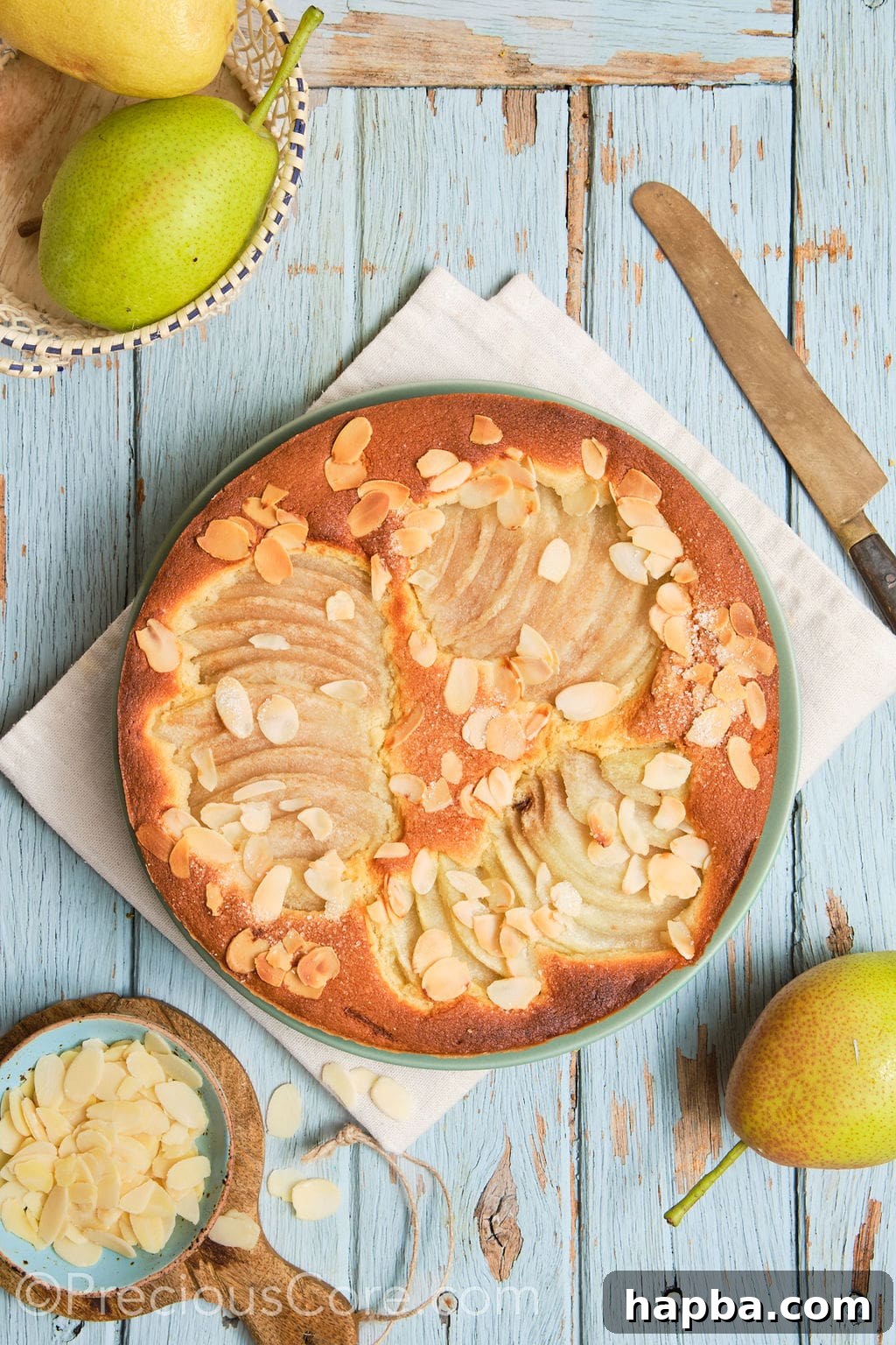 almond and pear cake on a serving plate. 