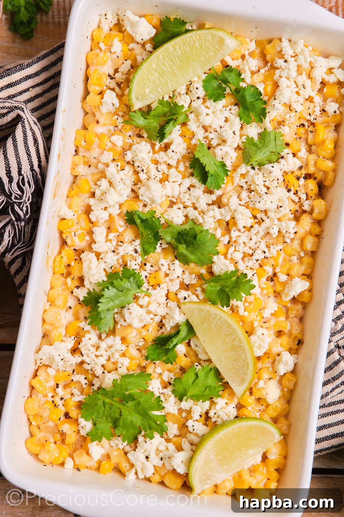 Creamy Elote Bake 10 A large white baking dish filled with creamy Mexican street corn casserole, ready to be served.