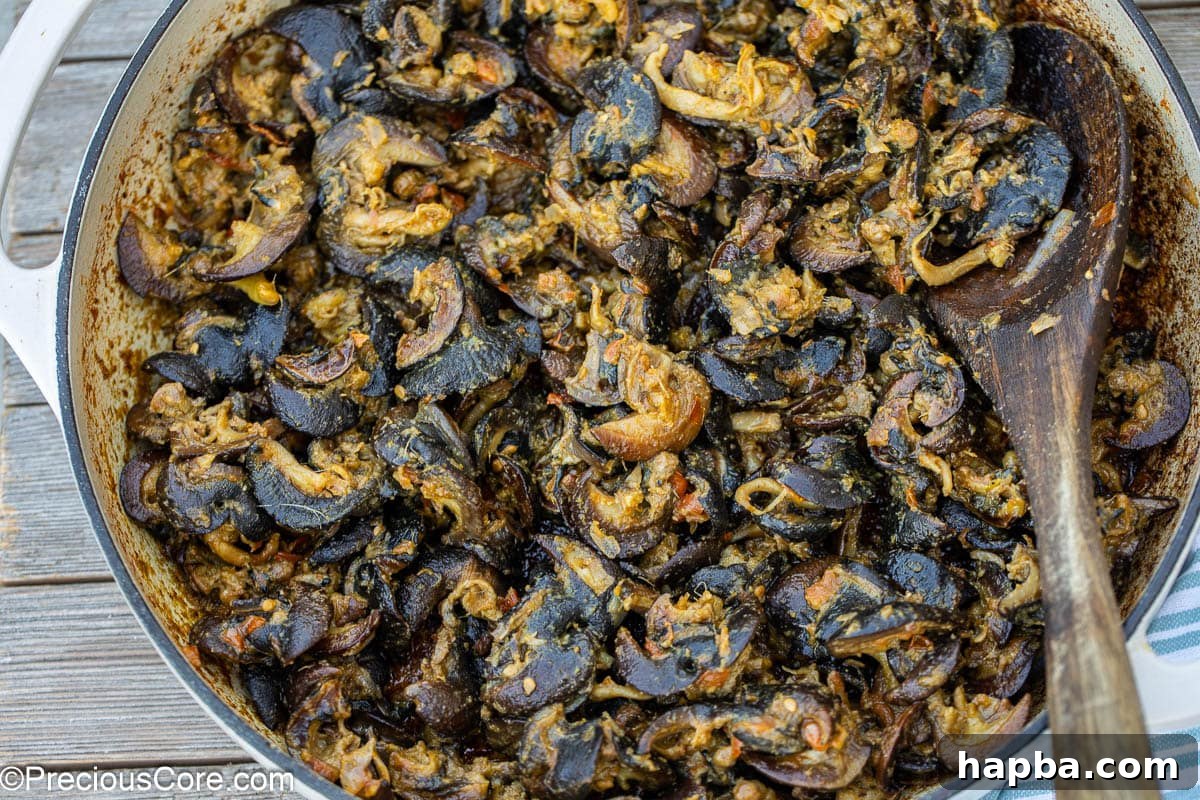 Authentic Cameroonian Snail Dish 3 Cameroonian snails recipe made in a pot.