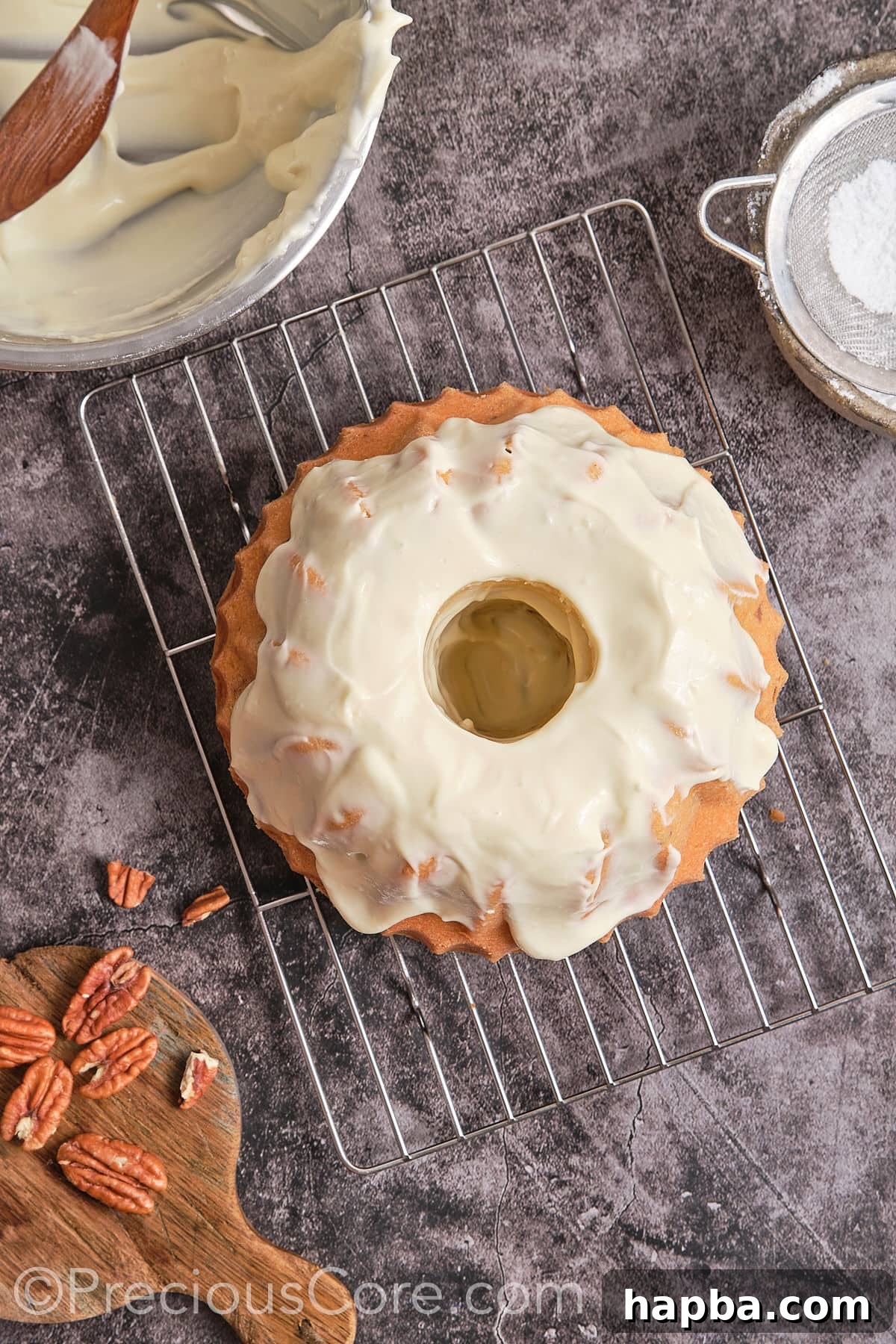 Decadent Butter Pecan Pound Cake 16 Spreading the smooth cream cheese frosting evenly over the cooled pound cake.
