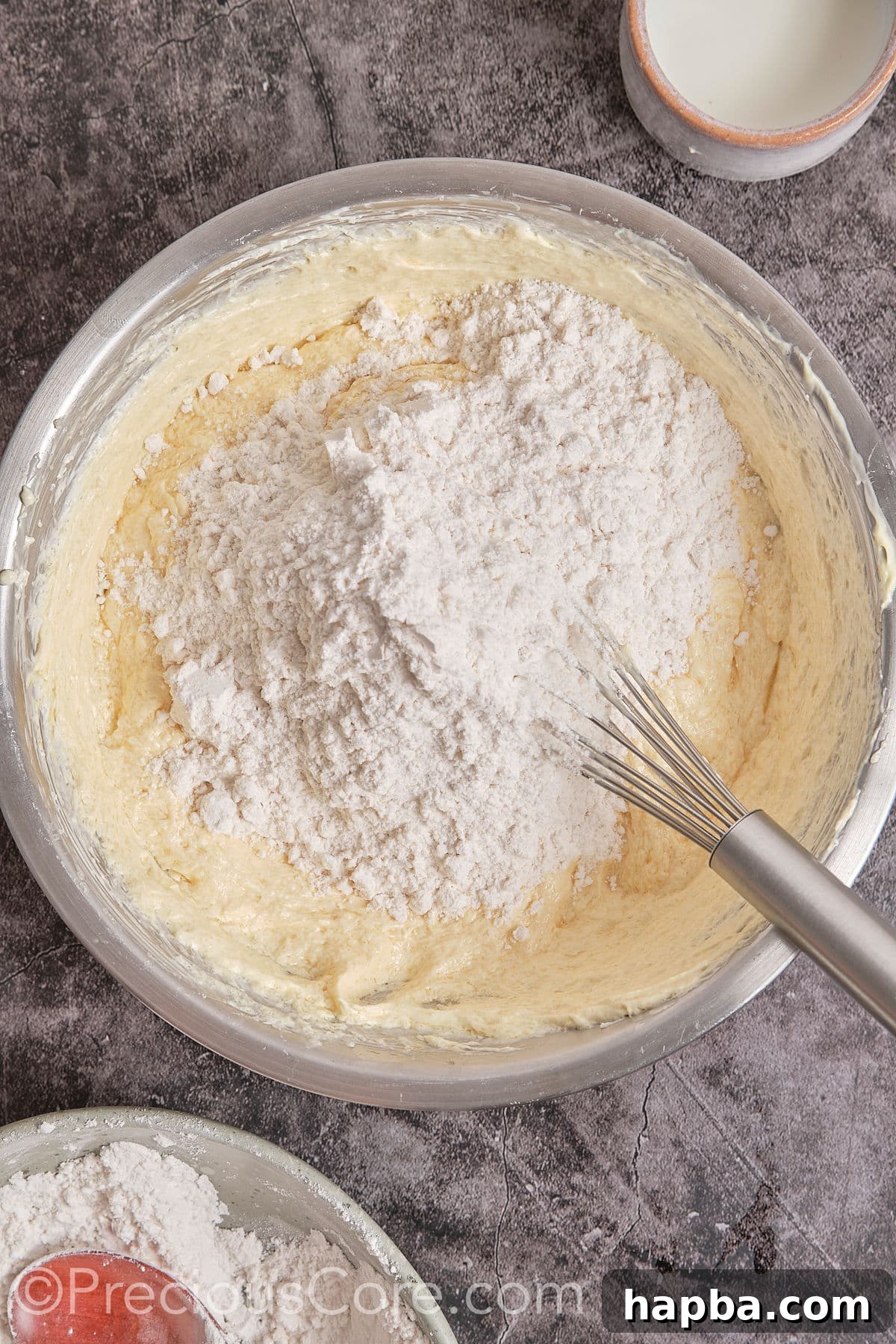 Decadent Butter Pecan Pound Cake 9 Adding the flour mixture to the wet ingredients and mixing until just combined.