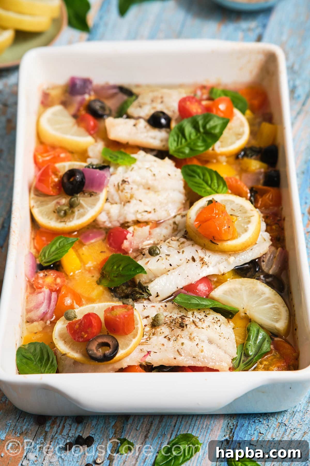 A close-up shot of perfectly baked Mediterranean fish, showing the flaky texture and vibrant roasted vegetables, garnished with fresh herbs.