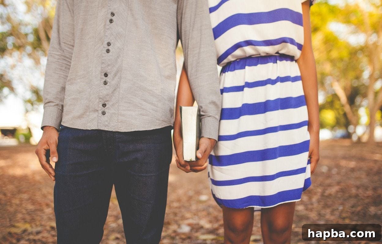 Elevating Your Marriage Through Prayer 2 A couple holding hands and a Bible, symbolizing faith and unity in marriage.