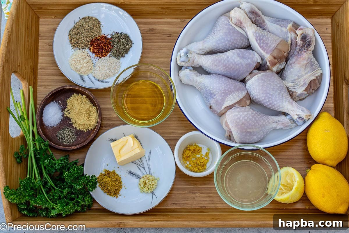 Golden Lemon Pepper Drumsticks 4 A collection of ingredients laid out on a surface for lemon pepper drumsticks recipe.
