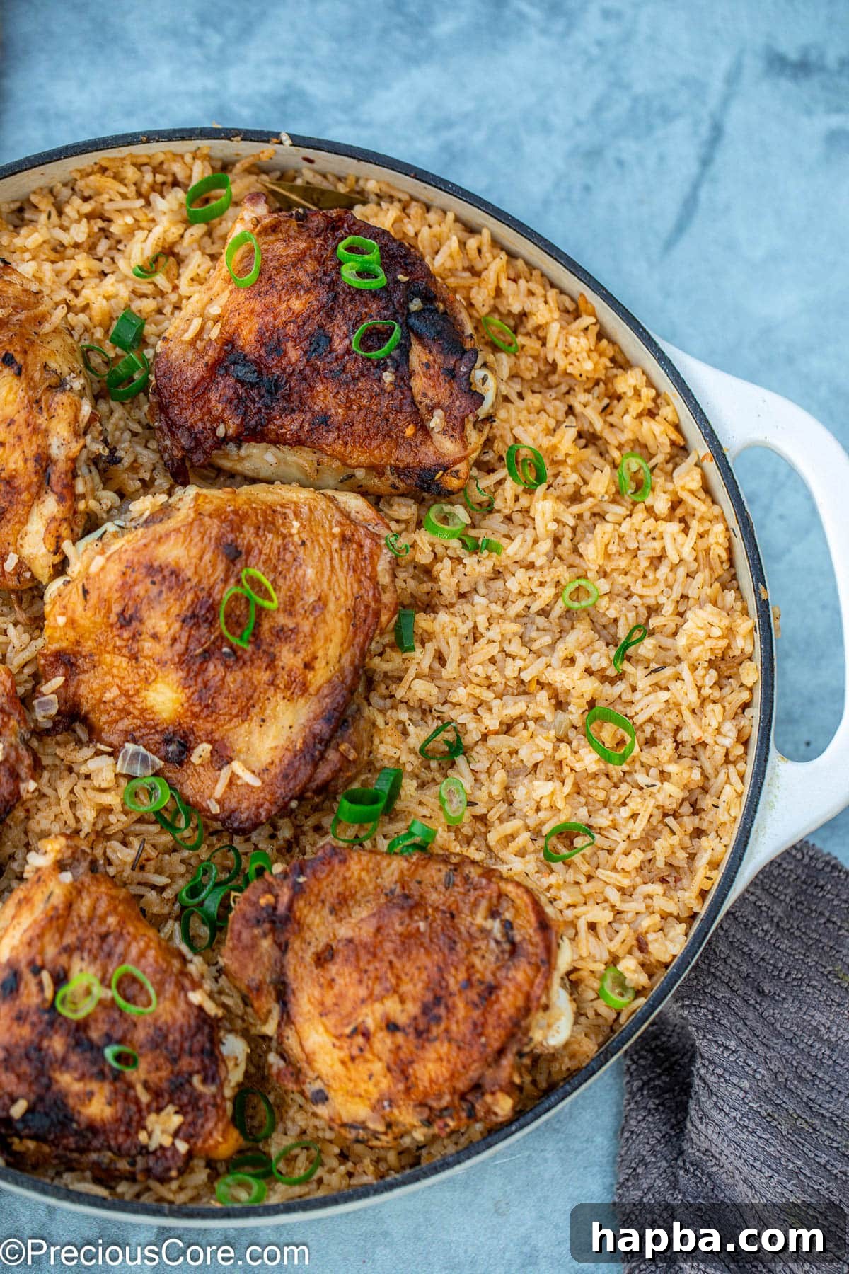 closeup of one pot chicken thighs and rice.