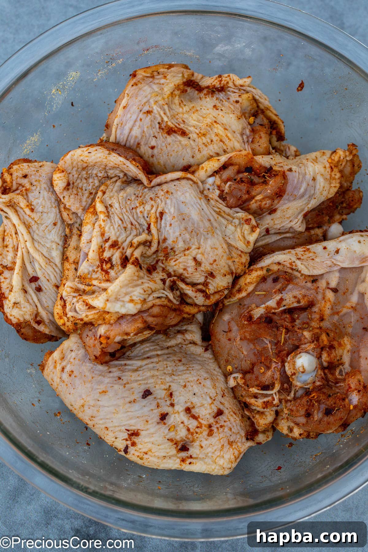 chicken thighs marinated in a mix of spices.