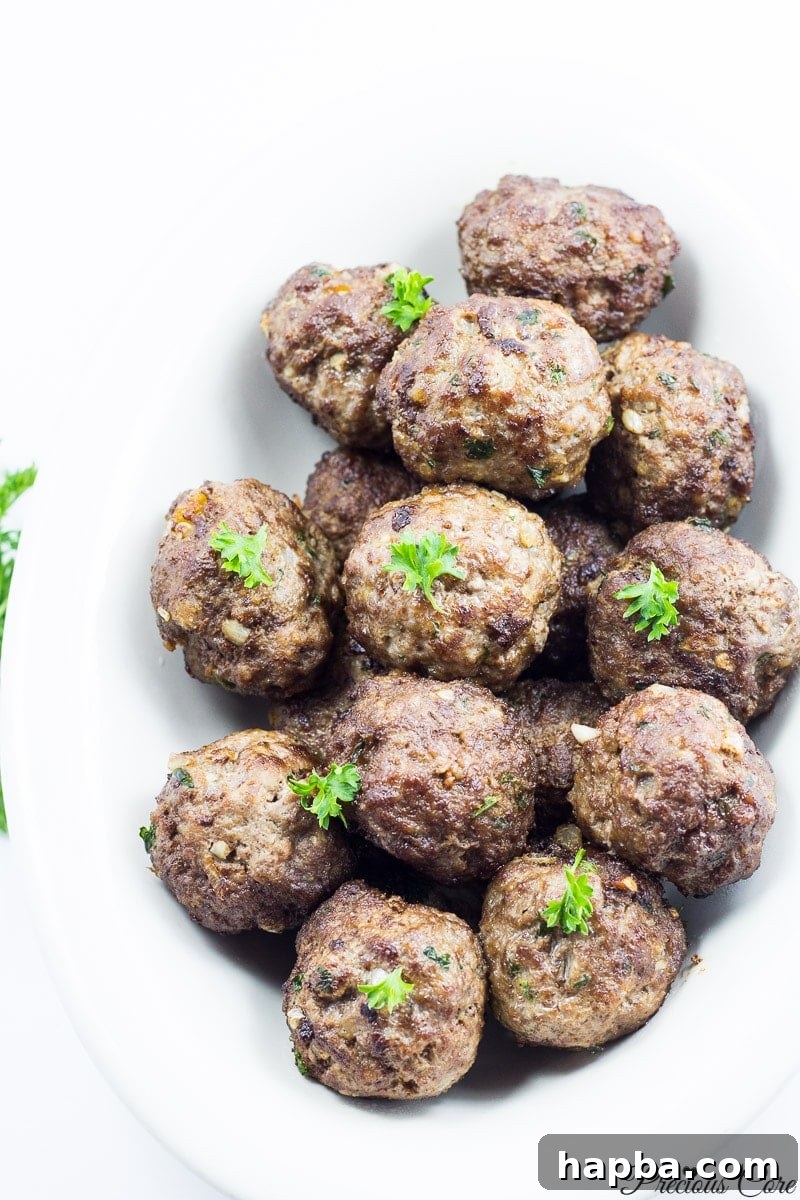 African Spiced Meatballs 2 Flavorful West African meatballs simmered in a rich tomato sauce, ready to be served over rice or pasta.