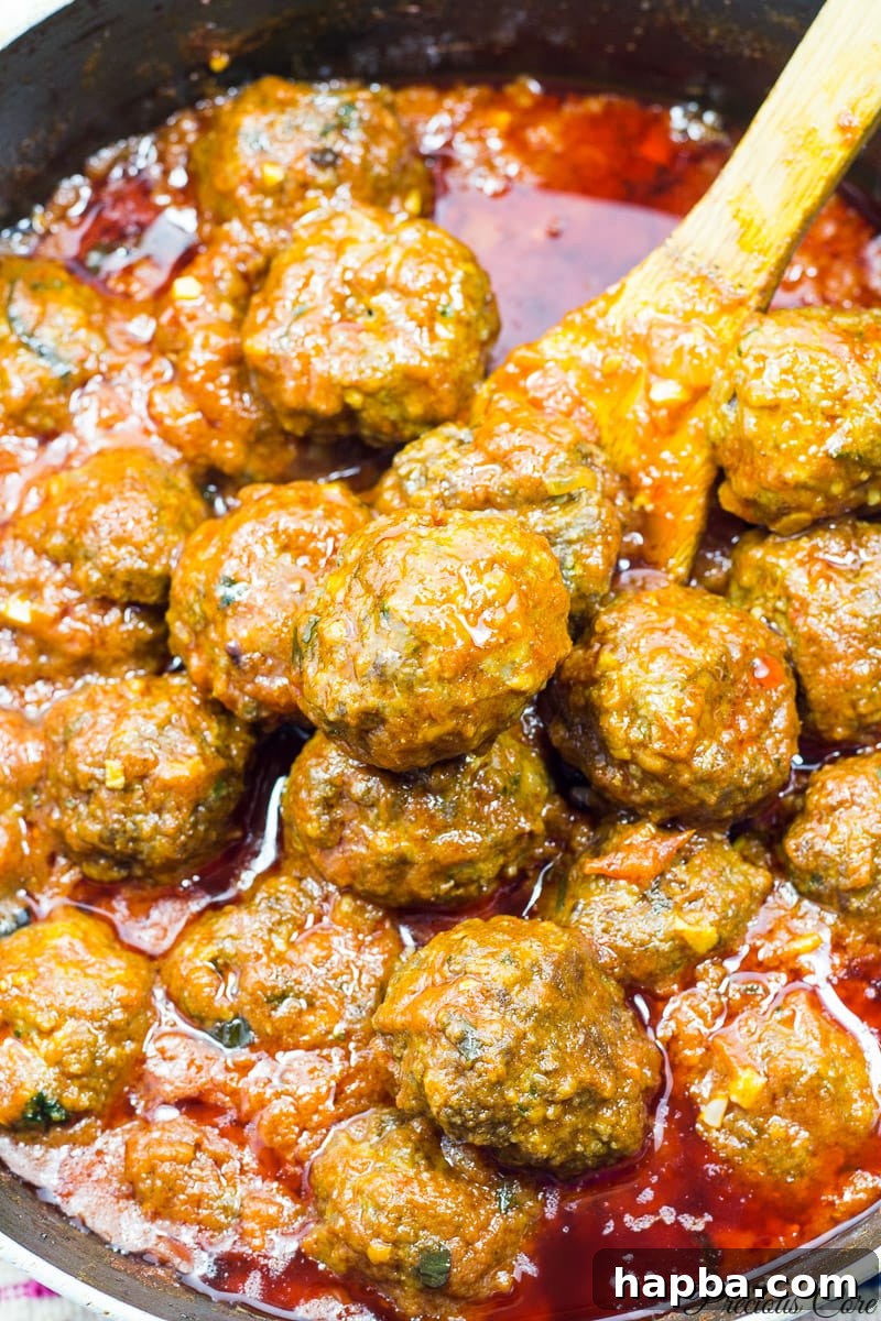 African Spiced Meatballs 12 African meatballs gently simmering in the rich tomato sauce, absorbing all the delicious flavors.
