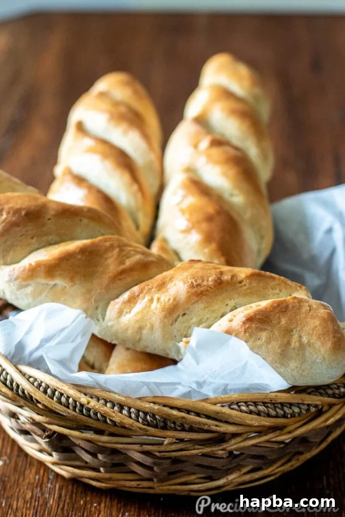 Homemade French Bread in a rustic basket, freshly baked and golden brown