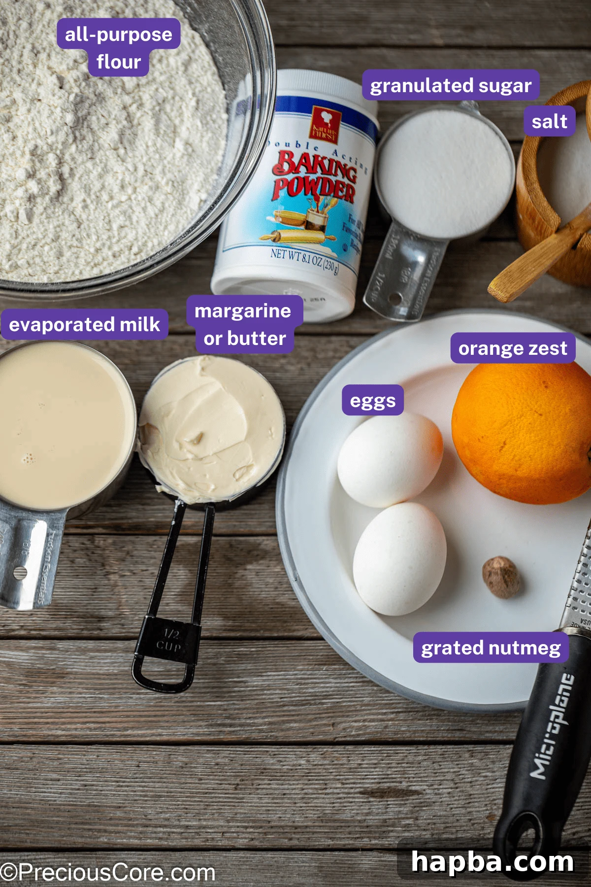 Key ingredients for the Chin Chin recipe laid out on a table: flour, sugar, butter, eggs, milk, nutmeg, and orange zest.