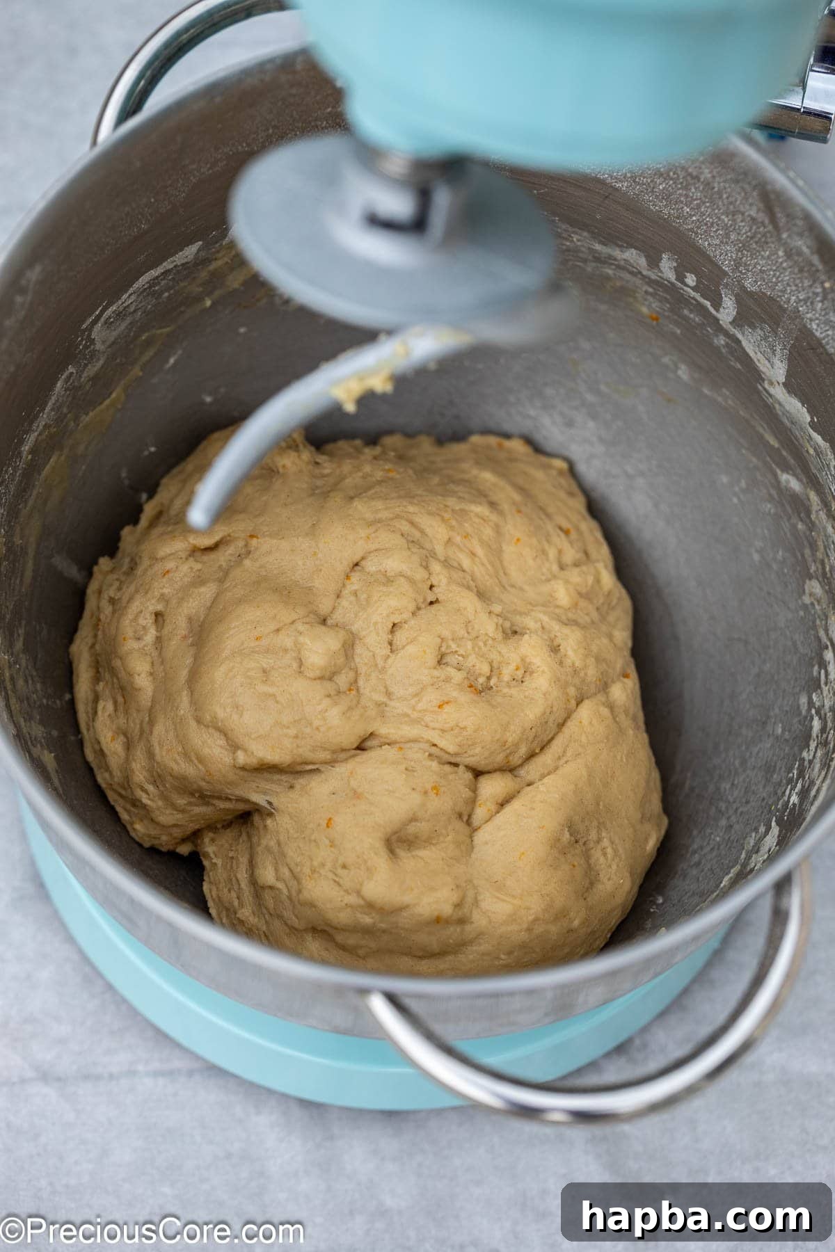 Chin Chin dough being kneaded in a stand mixer.