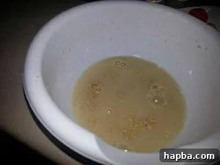 Puff-Puff batter after initial mixing, showing its smooth consistency.