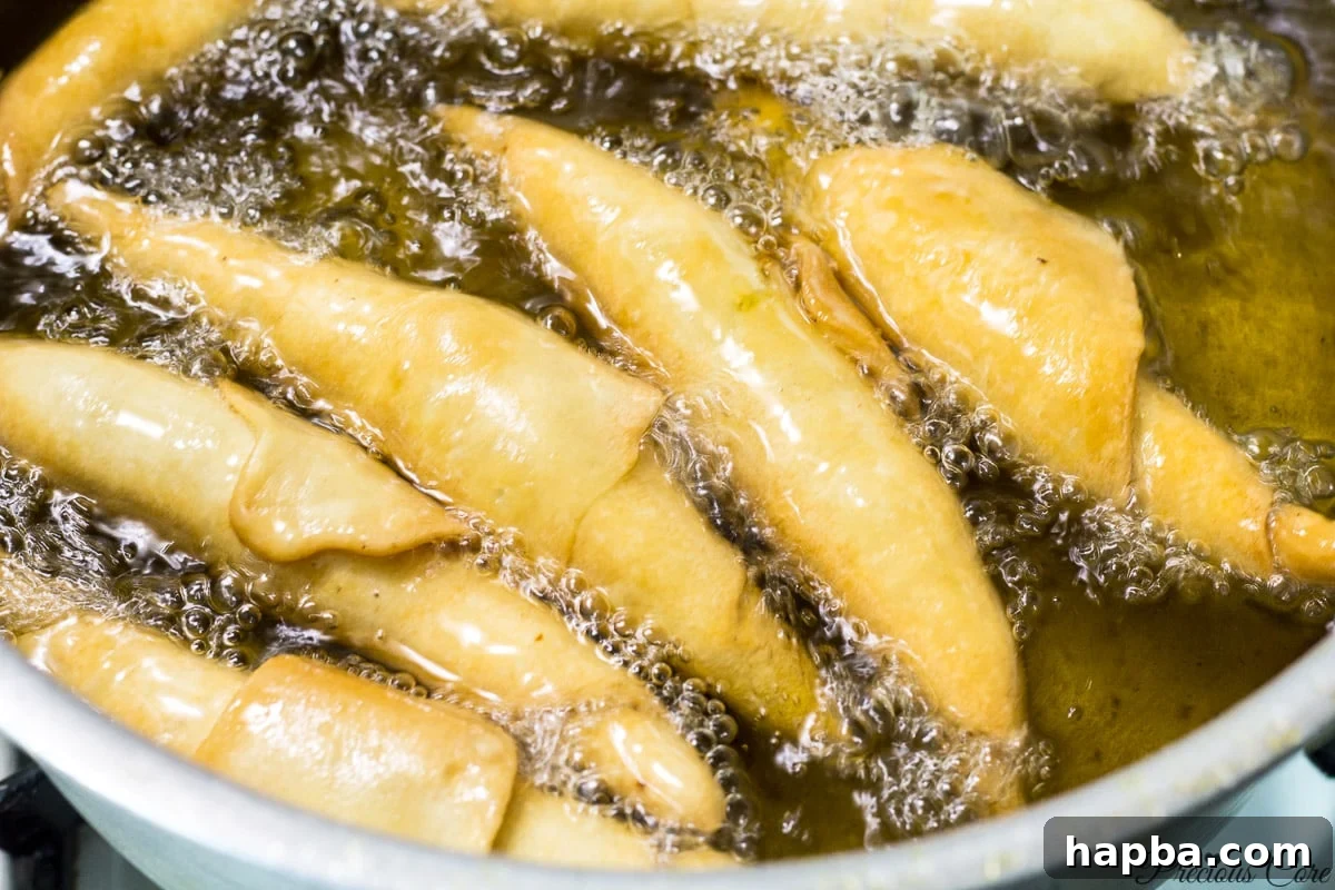 Savory Cameroonian Fish Rolls 14 Golden-brown and perfectly crispy Cameroonian fish rolls, freshly fried.