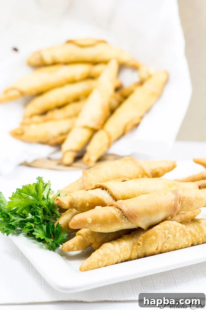 Savory Cameroonian Fish Rolls 16 A basket and plate overflowing with the best homemade Cameroonian fish rolls.