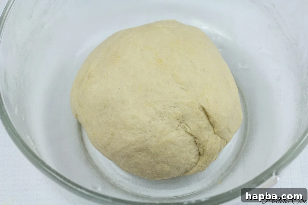 Savory Cameroonian Fish Rolls 8 Mixing the ingredients to form the dough for Cameroonian fish rolls.