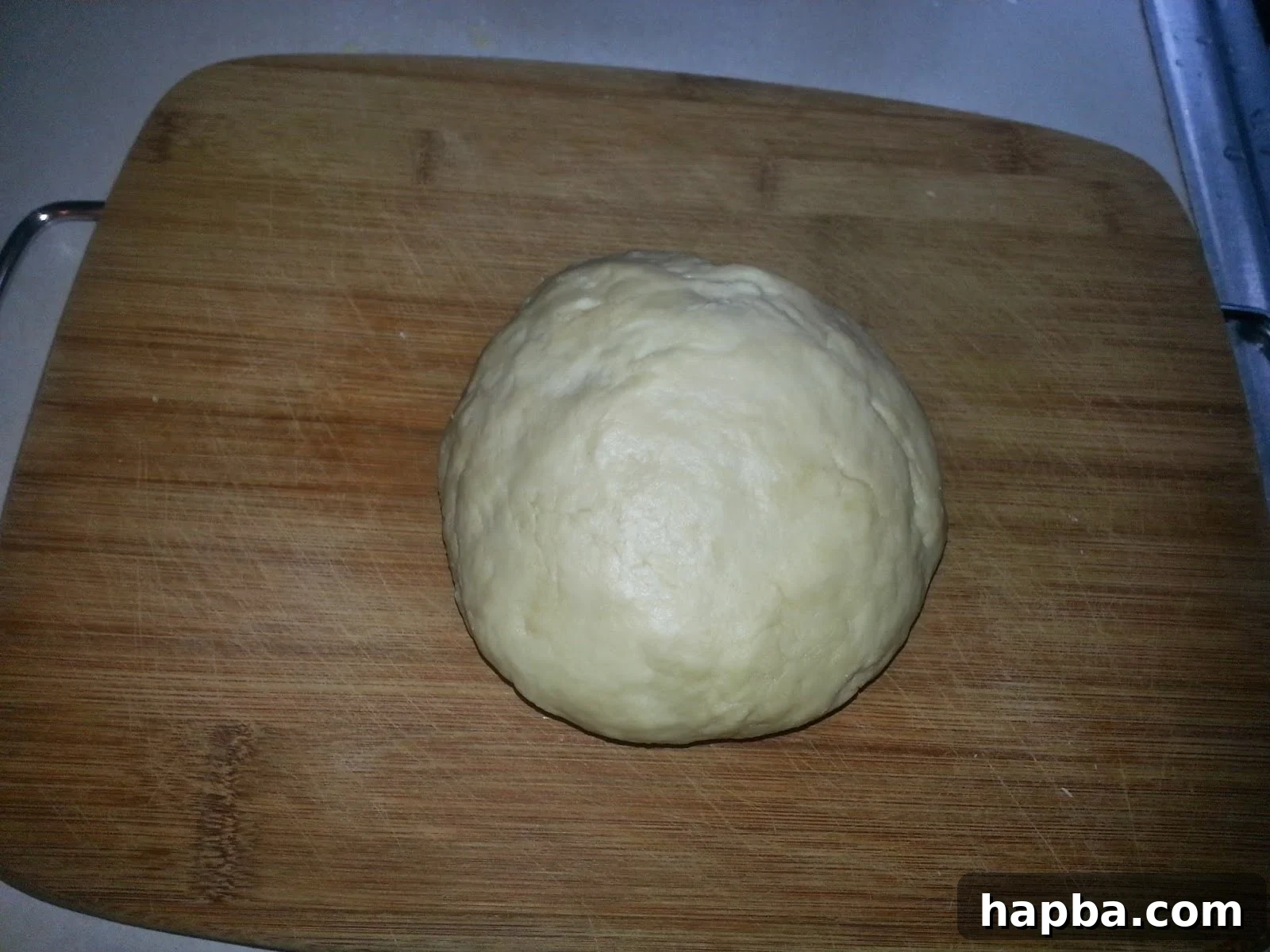 Simple Homemade Milk Bread 3 Shaggy dough on a rolling board, showing initial consistency before kneading