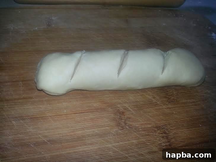 Simple Homemade Milk Bread 8 Shaped dough with three diagonal slashes on its top surface