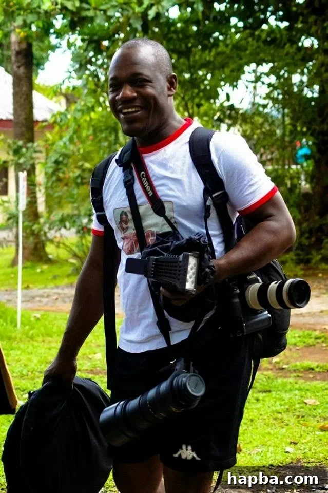Penjo Baba The Photographer Bringing Change Into Focus 3 Penjo Baba capturing a moment with his camera, embodying passion.
