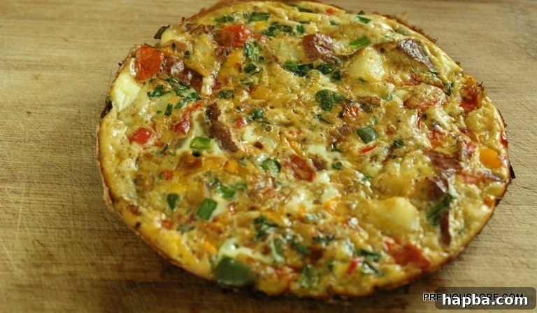 A whole frittata cooling on a cutting board.