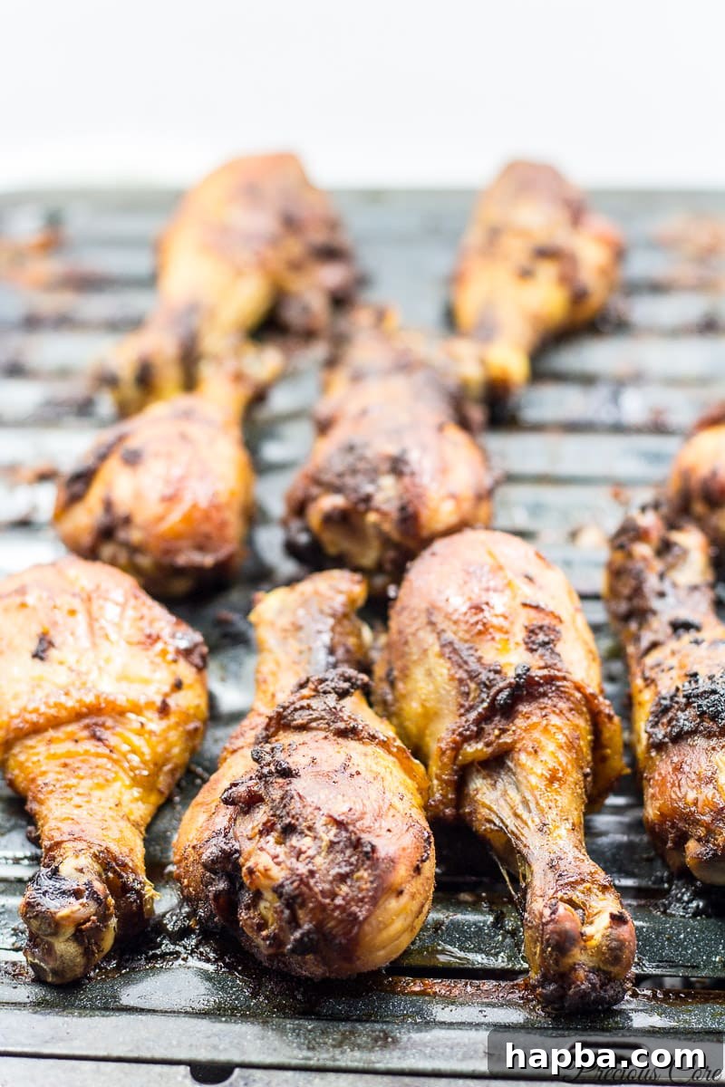 Perfectly oven grilled chicken, golden brown and crispy, resting on a baking tray after cooking.