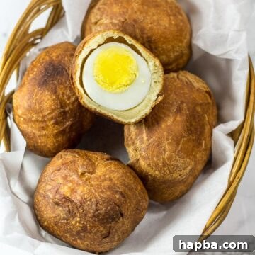 Basket of African egg rolls, beautifully arranged and ready for serving, showcasing their golden-brown exterior.